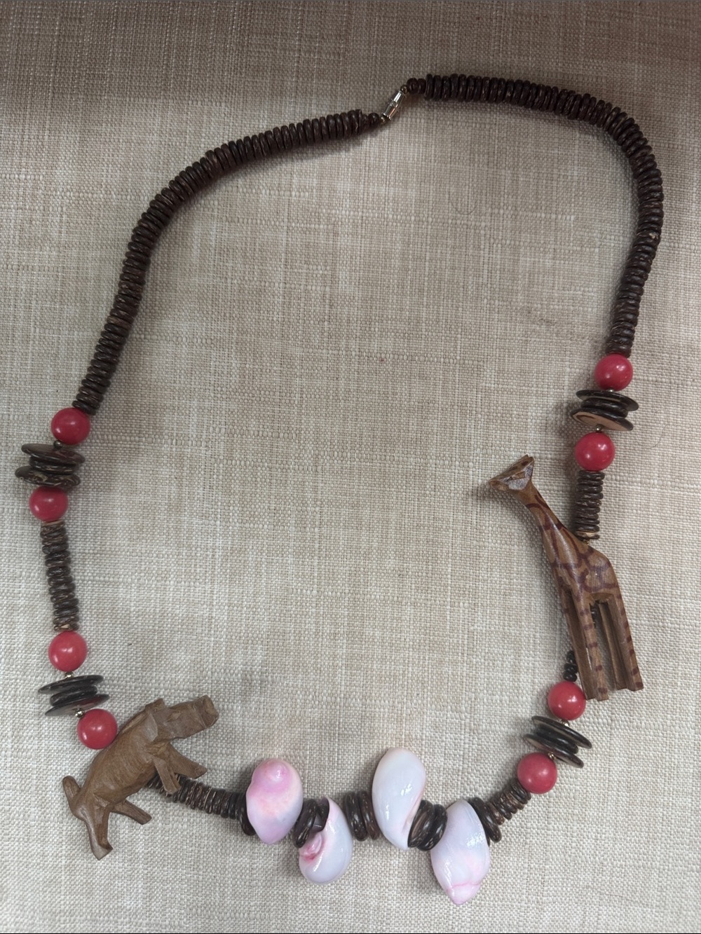 Handcrafted Brown Bead Necklace with Pink Accents and Carved Wood Charms